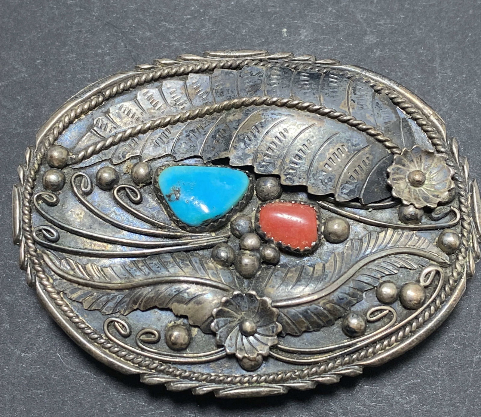 STERLING NAVAJO RED CORAL TURQUOISE BELT BUCKLE: OLD PAWN VINTAGE NATIVE AMERICAN NAVAJO BELT BUCKLE. UNMARKED UNSIGNED TESTED STERLING SILVER. MEASURES 2.5" X 1.75". FITS 1.25" BELT. WEIGHS 26 GRAMS. USA SHIPPING $5.