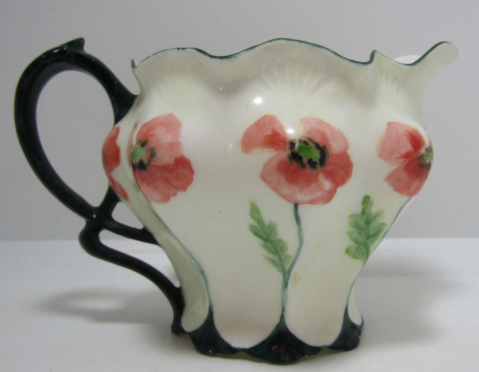 EGG SHELL PORCELAIN CREAMER HAND PAINTED 1907: SIGNED "LIDDLE '07". MEASURES 5 INCHES BY 3 3/4 INCH BY 3 1/4".. EXCELLENT CONDITION. USA SHIPPING $5.