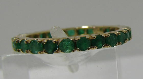 EMERALD ETERNITY BAND RING 14K YELLOW GOLD: ETERNITY BAND OF 26 GENUINE EMERALDS. TOP MEASURES 2MM WIDE. WEIGHS 1.6 GRAMS. SIZE 6. EXCELLENT CONDITION. USA SHIPPING $5.