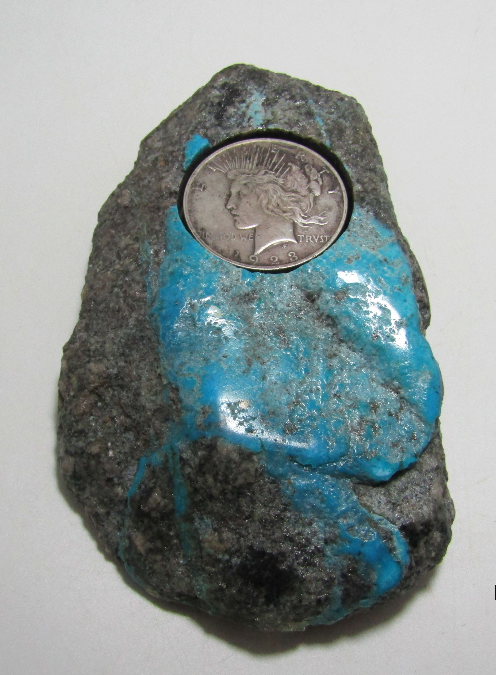 1923 SILVER DOLLAR TURQUOISE PAPERWEIGHT (1 of 2)