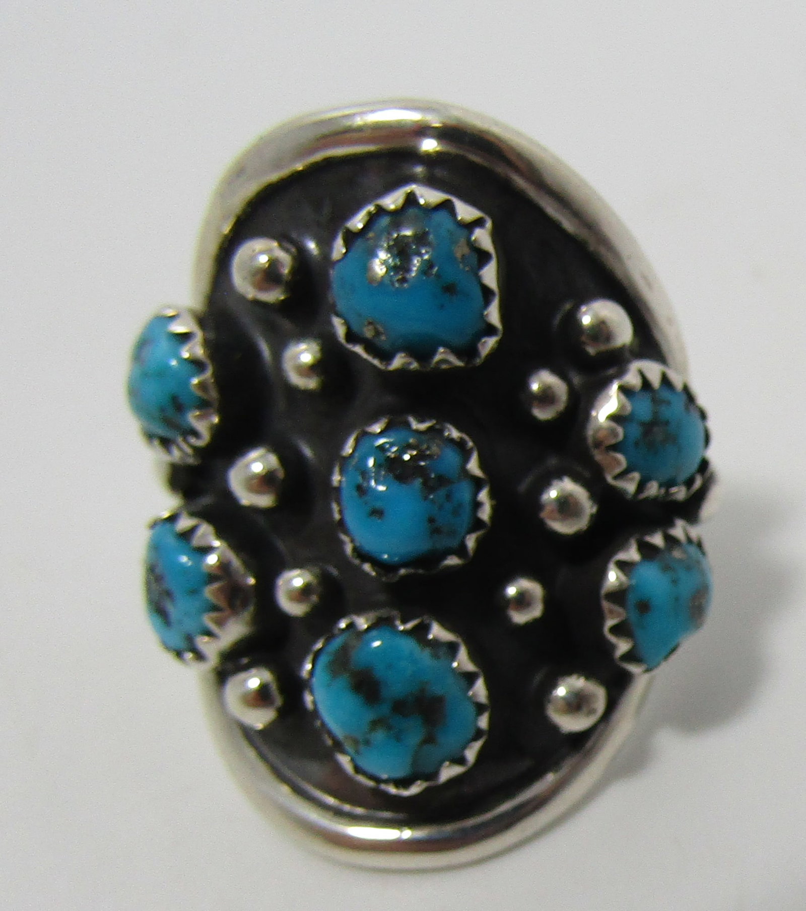 TOMMY JACKSON TURQUOISE RING STERLING SILVER: MARKED "TJ STERLING" TOMMY JACKSON. NATIVE AMERICAN SOUTHWEST NAVAJO INDIAN JEWELRY. TOP MEASURES 28MM. WEIGHS 7.9 GRAMS. SIZE 7. EXCELLENT CONDITION. USA SHIPPING $5.