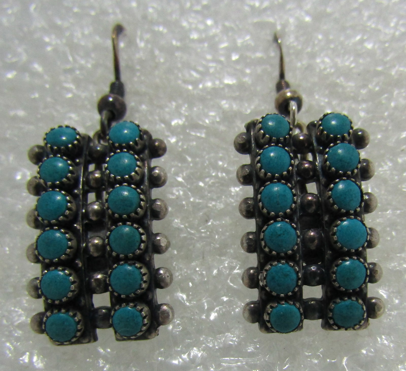 SNAKE EYE TURQUOISE EARRINGS STERLING SILVER: FRED HARVEY ERA VINTAGE ESTATE NATIVE AMERICAN SOUTHWEST INDIAN JEWELRY. BEZEL MOUNTED WITH 24 TURQUOISE STONES. MEASURE 1 1/2 INCHES LONG BY 14MM WIDE. MARKED "STERLING" WEIGH 8.7 GRAMS. USA SHIPPING