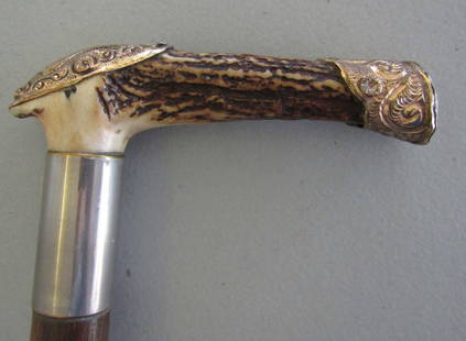 GOLD & STAG CANE WALKING STICK: 35 INCH STAG GRIP CANE WITH ROLLED GOLD ACCENTS. MONOGRAMMED E.LT,L. 5 INCH GRIP ON 7/8 CARVED WOOD SHAFT. HAS PLATED BRASS RING. USA SHIPPING $5.WITH INS.