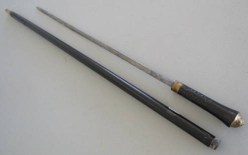 LION SWORD CANE WALKING STICK: 36 INCH CANE WITH 21 INCH SWORD. 1 INCH TAPERED WOOD SHAFT. HAS EMBOSED LION KNOB WITH TWIST LOCK. USA SHIPPING $5.WITH INS.