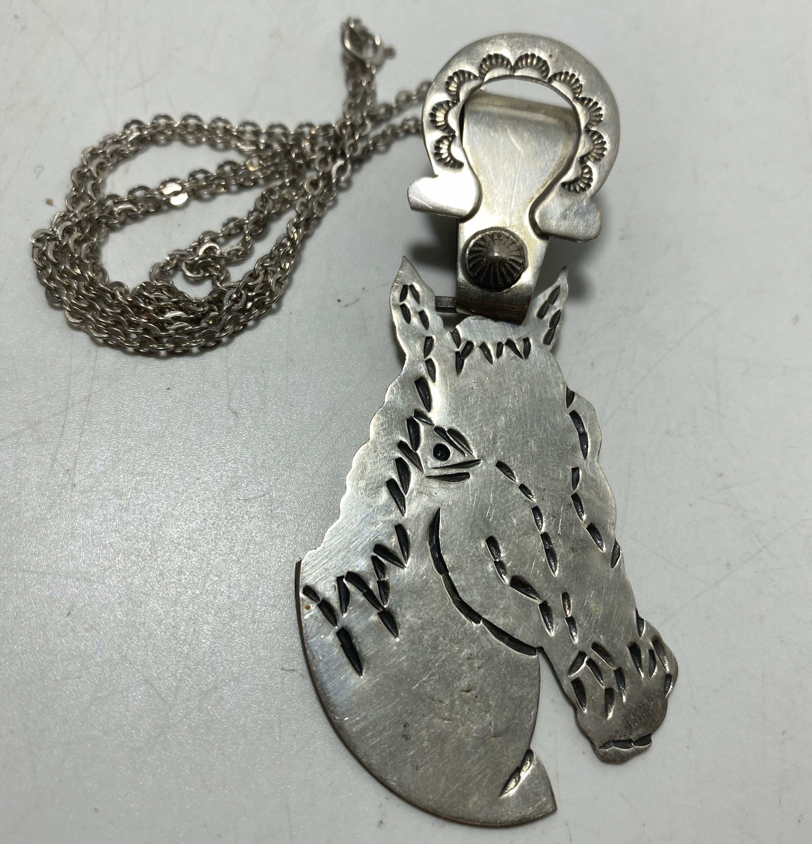 3" STERLING GILBERT TOM NAVAJO HORSE NECKLACE: NEW OLD STOCK NATIVE AMERICAN HANDMADE PENDANT. SIGNED MARKED TESTED STERLING SILVER. WEIGHS 14.5 GRAMS. MEASURES 3" X 1.25". CHAIN IS 20". USA SHIPPING $5.