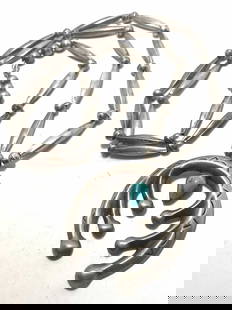 29" STERLING NAVAJO NAJA PENDANT BEADED NECKLACE: NATIVE AMERICAN HANDMADE BEADED NECKLACE. UNMARKED UNSIGNED. BEADS AND PENDANT TESTED STERLING SILVER, HAS 1" ELONGATED BEADS. TOTAL WEIGHT 63 GRAMS. NAJA IS 2.25" X 2.25". TOTAL LENGTH 29.5".