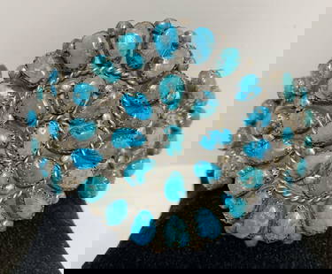 ZUNI STERLING MORENCI TURQUOISE CLUSTER BRACELET: VINTAGE 1980S NATIVE AMERICAN HANDMADE CUFF BRACELET. GORGEOUS MORENCI TURQUOISE STONES HAVE PYRITE MATRIX. HEIGHT OF CLUSTER IS 2.25". GAP IS 1.25" AND FITS 7" WRIST TOTAL. UNMARKED UNSIGNED