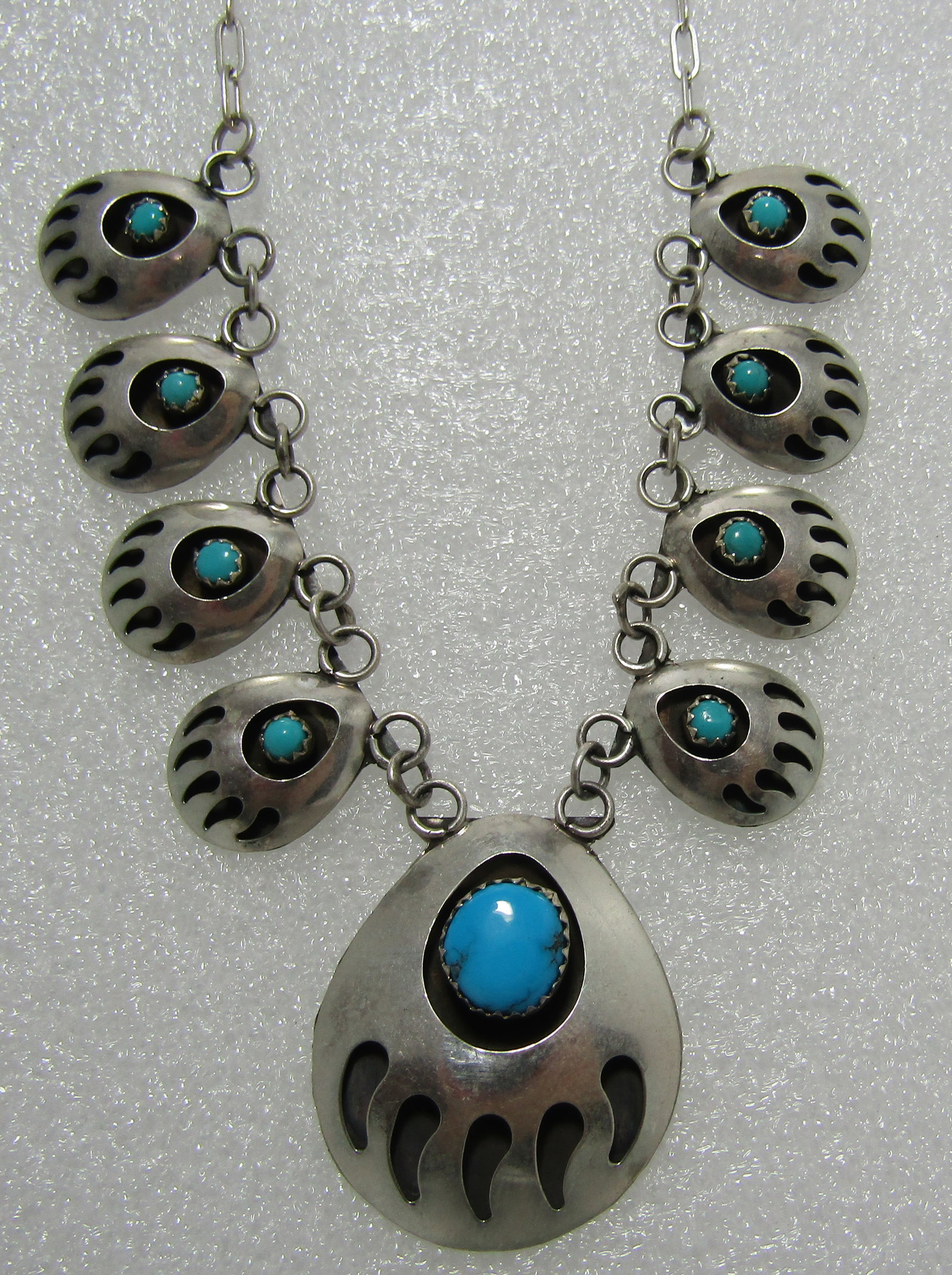 TURQUOISE BEAR CLAW PAW NECKLACE STERLING SILVER: UNSIGNED TESTED STERLING SILVER. NATIVE AMERICAN SOUTHWEST NAVAJO INDIAN JEWELRY. LINK CHAIN MEASURES 18 INCHES LONG PLUS A 1 INCH BY 1 INCH DROP . WEIGH 15.1 GRAMS. EXCELLENT CONDITION. USA SHIPPING 