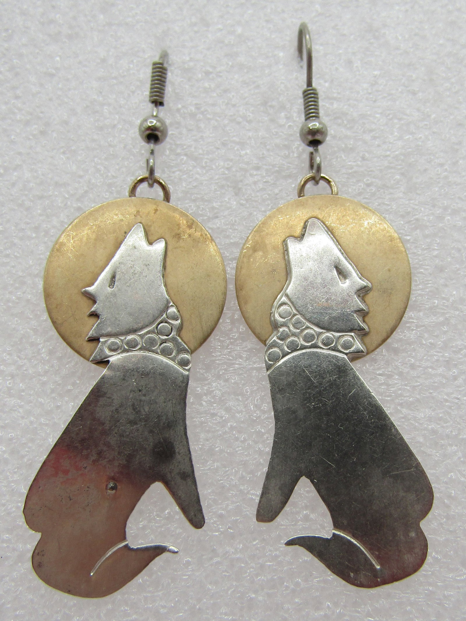 COYOTE MOON EARRINGS STERLING SILVER & BRASS: VINTAGE ESTATE MIXED METAL TESTED STERLING SILVER WITH BRASS ACCENT MOONS. MEASURE 2.5 INCHES BY .75 INCH. WEIGHS 6.1 GRAMS. USED CONDITION. USA SHIPPING $5. NO INTERNATIONAL SHIPPING.