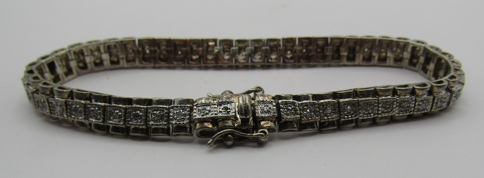 DIAMOND TENNIS BRACELET STERLING SILVER: GENUINE DIAMOND GEMSTONE BRACELET. VINTAGE ESTATE MEASURES 7 INCHES LONG. WEIGHS 17.4 GRAMS. EXCELLENT USED CONDITION. USA SHIPPING $5. NO INTERNATIONAL SHIPPING.