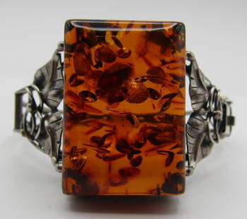 FOSSILIZED BALTIC AMBER BRACELET STERLING SILVER: VINTAGE ESTATE BALTIC AMBER BRACELET. TOP MEASURES 1.25" BY 1". FITS A 7 INCH WRIST, OPENS FOR EASY ON AND OFF. WEIGHS 29.3 GRAMS. EXCELLENT USED CONDITION. USA SHIPPING $5. NO INTERNATIONAL SHIPPING.