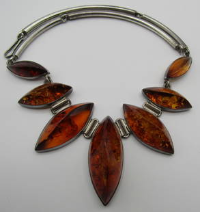 FOSSILIZED BALTIC AMBER NECKLACE STERLING SILVER: HALLMARKED VINTAGE ESTATE BALTIC AMBER NECKLACE. MEASURES 17" LONG BY 2" AT IT'S WIDEST. WEIGHS 75.2 GRAMS. EXCELLENT USED CONDITION. USA SHIPPING $5. NO INTERNATIONAL SHIPPING.