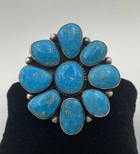 49 GRAM LIVINGSTON STERLING TURQUOISE CLUSTER RING: HANDMADE NATIVE AMERICAN NAVAJO RING. GORGEOUS BLUE RIDGE MINE TURQUOISE STONES. SIGNED "DARRIN LIVINGSTON STERLING" TESTED STERLING SILVER. WEIGHS 49 GRAMS. MEASURES 2.5" X 2.25". RING SIZE