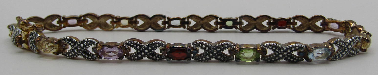 MULTI STONE GEM BRACELET 18K GOLD STERLING SILVER: VINTAGE ESTATE COLLECTION OF ASSORTED STONES: GARNET, PERIDOT, TOPAZ, CITRINE, AMETHYST. MEASURES 7 1/2 INCHES LONG. WEIGHS 10.0 GRAMS. NEW IN BOX, EXCELLENT COLLECTION. USA SHIPPING $5. 