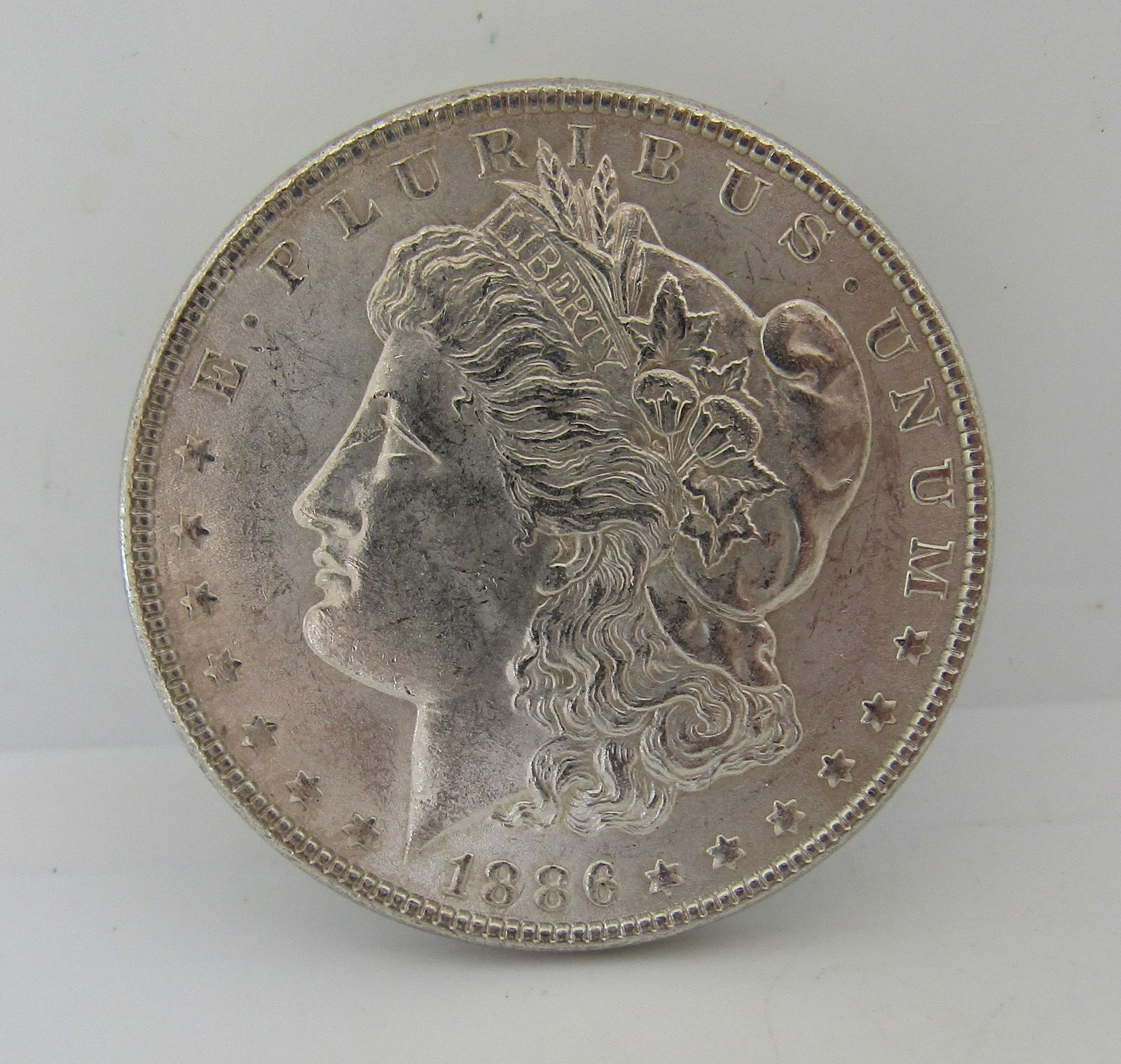 1886 MORGAN SILVER DOLLAR COIN UNC US COIN (1 of 2)