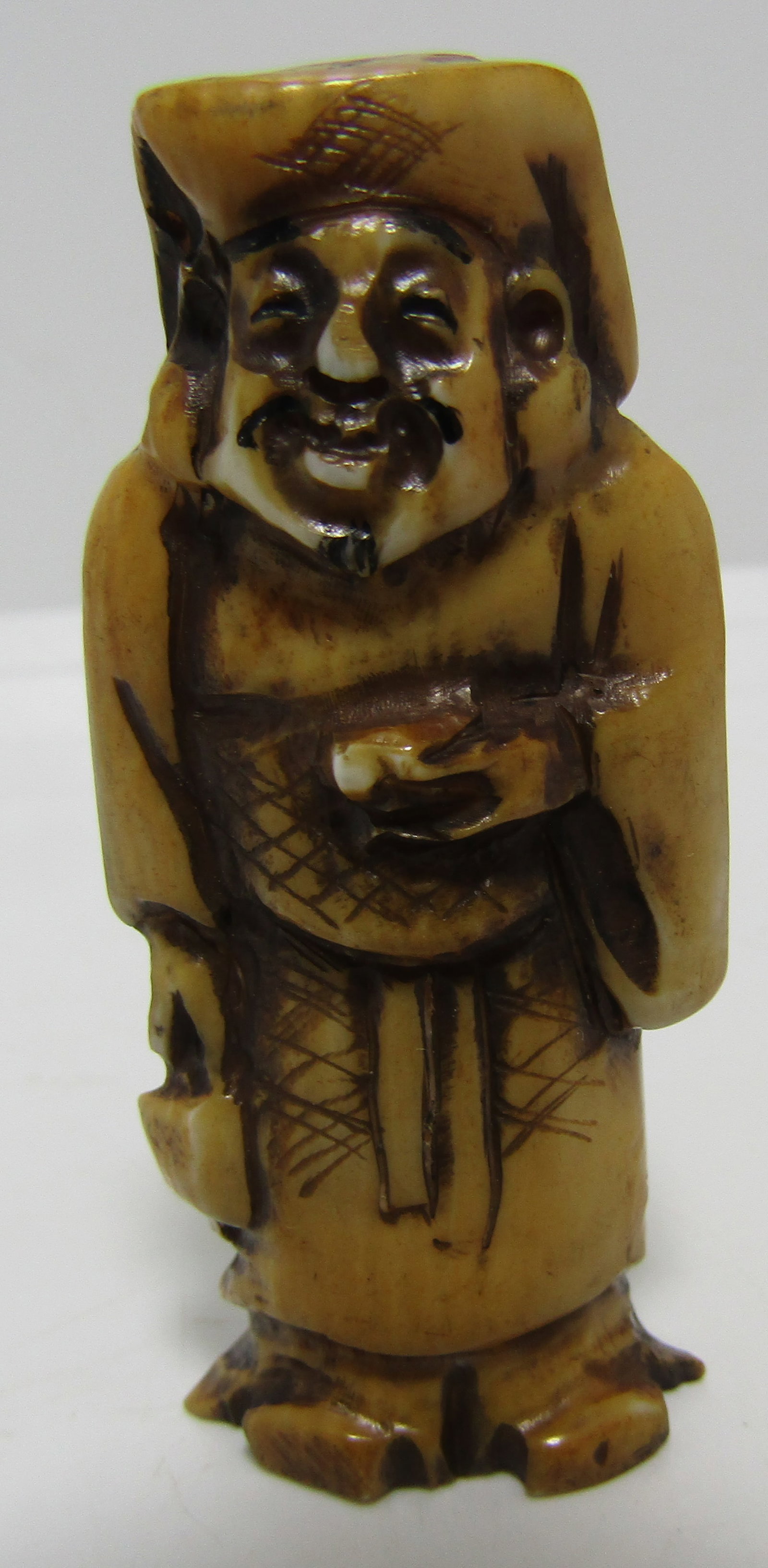 ARTIST SIGNED & CARVED NETSUKE OF AN ELDER FOSSIL (1 of 4)