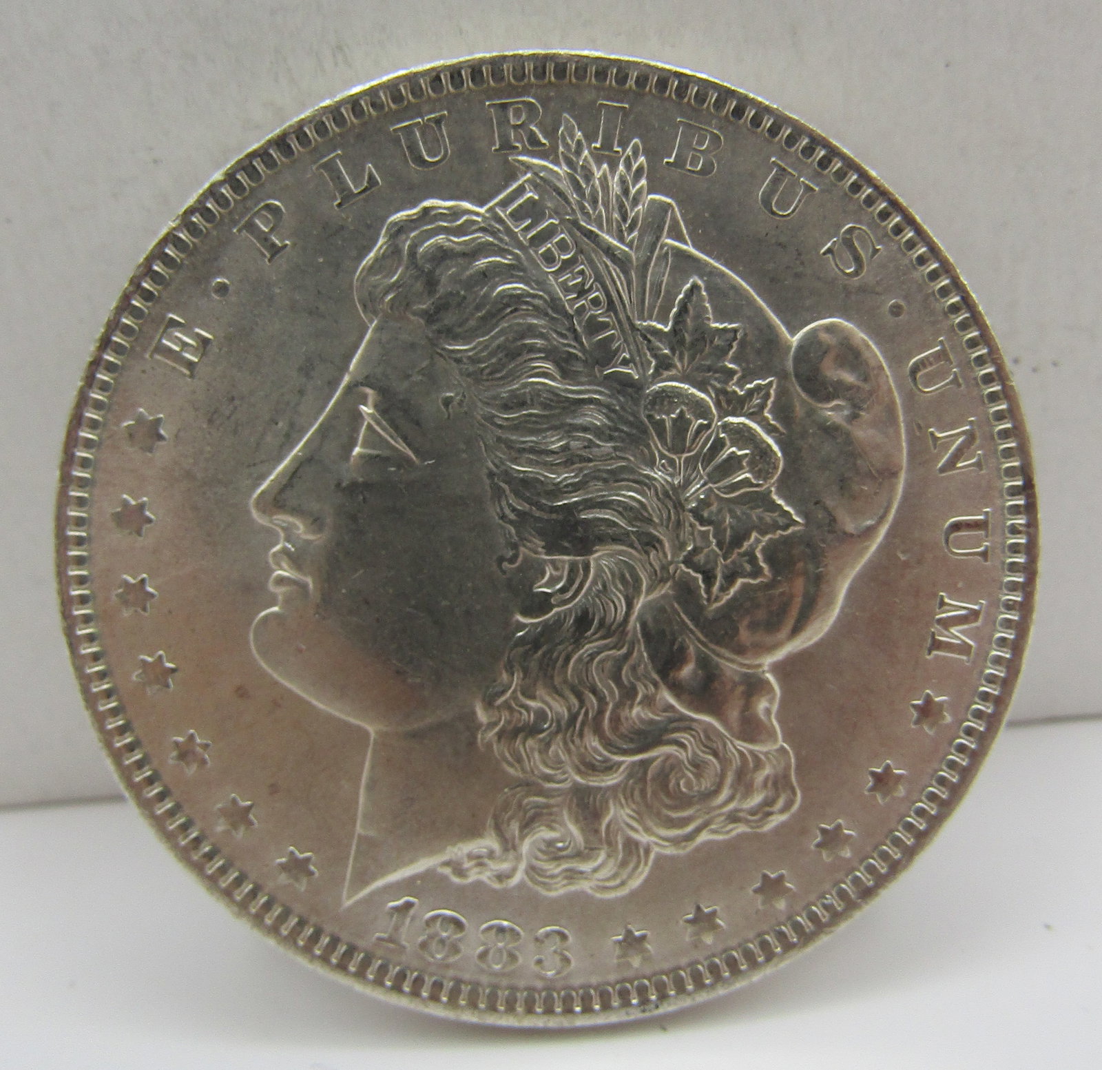 1883 O U.S. MORGAN SILVER DOLLAR COIN (1 of 2)