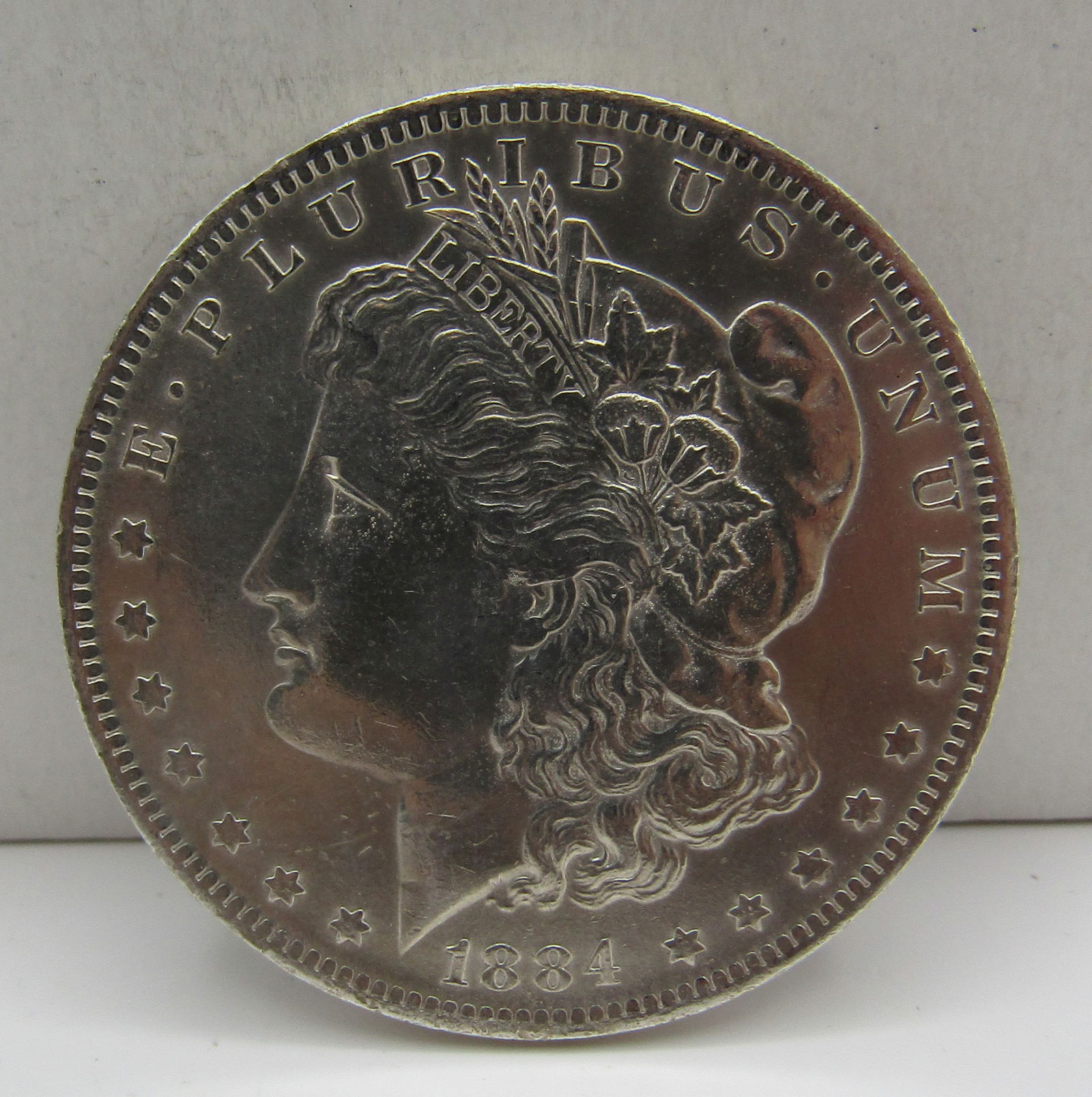 1884 O  U.S. MORGAN SILVER DOLLAR COIN (1 of 2)