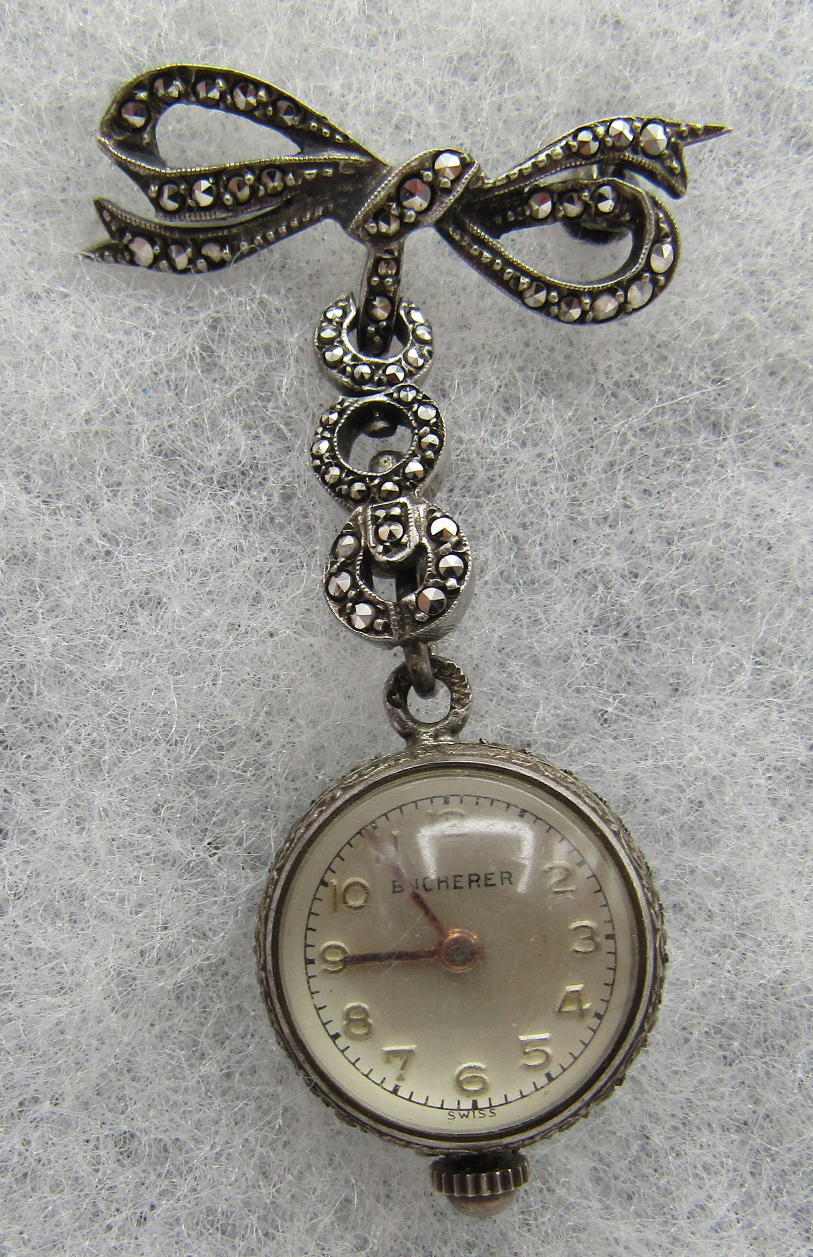 BUCHERER SKELETON BALL WATCH PIN STERLING SILVER: SPARKLING ANTIQUE VINTAGE ESTATE 15 JEWEL SWISS BUCHERER LAVALIER MARCASITE PIN. MARKED "800 CB". WATCH 18MM. PIN 28MM WIDE X 51MM LONG. WEIGHS 11.1 GRAMS. USA SHIPPING $5. NO INTERNATIONAL SHIPPING