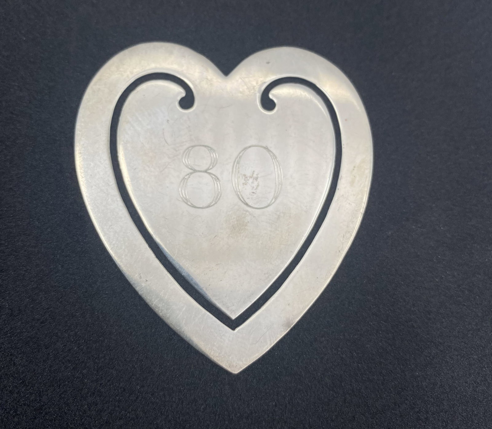 2" TIFFANY AND COMPANY STERLING HEART BOOKMARK: GENUINE TIFFANY AND CO HEART BOOKMARK. 2" TALL WEIGHS 7.6 GRAMS. TESTED STERLING SILVER. USA SHIPPING $5.