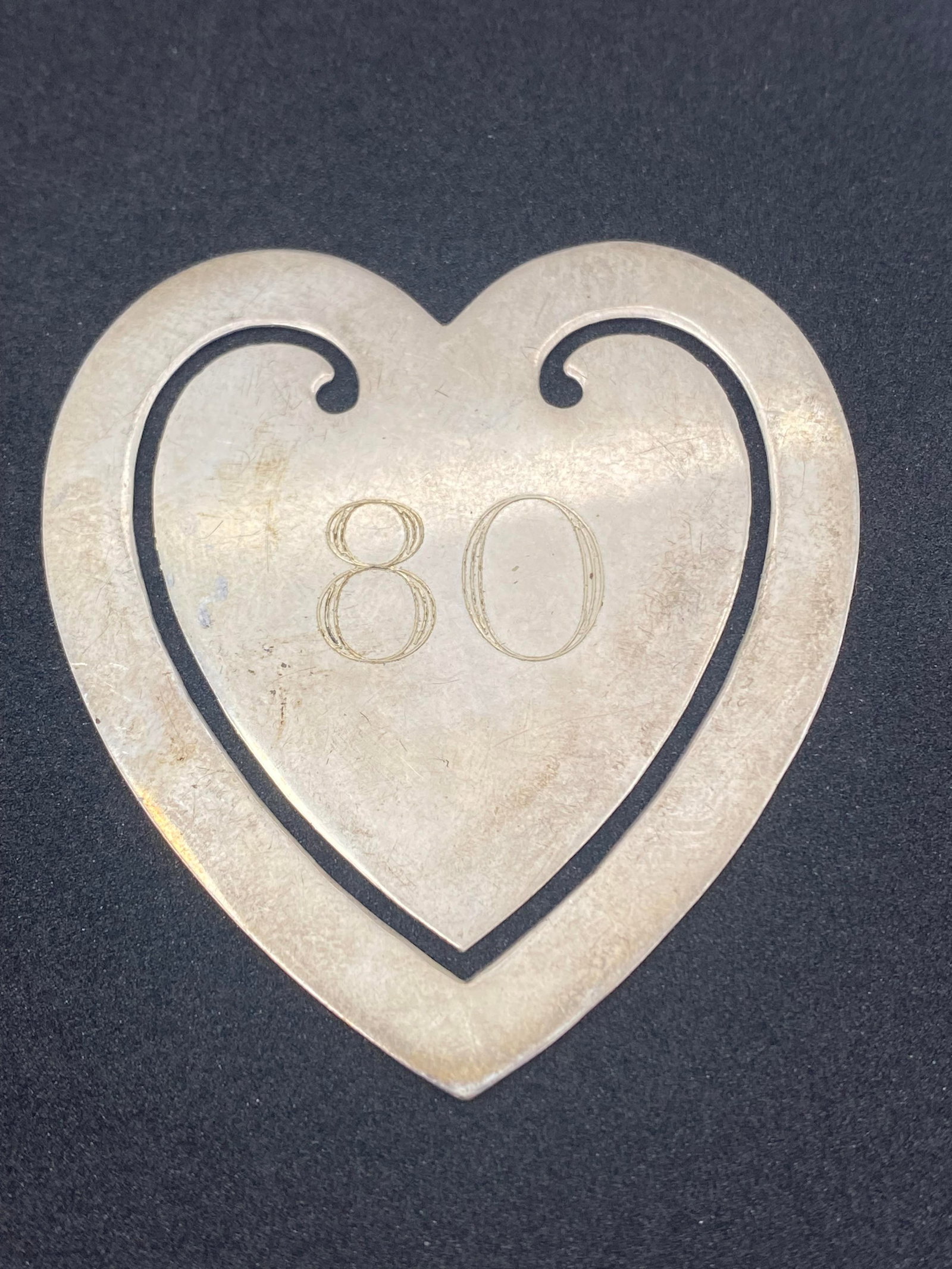 2" TIFFANY AND COMPANY STERLING HEART BOOKMARK: MONOGRAMMED "80" GENUINE TIFFANY AND CO HEART BOOKMARK. 2" TALL WEIGHS 7.9 GRAMS. TESTED STERLING SILVER. USA SHIPPING $5.