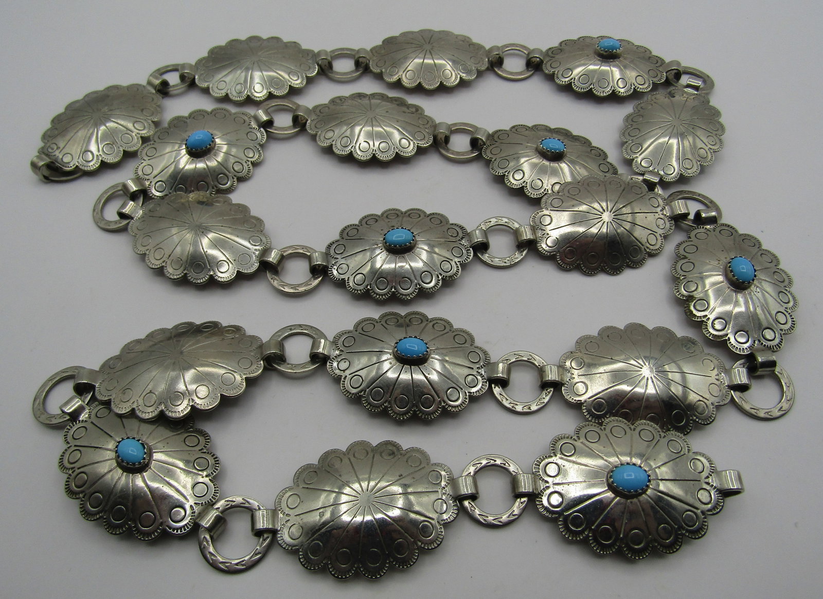 18 CONCHO BELT & BUCKLE 37 INCHES LONG: VINTAGE ESTATE COSTUME BELT MEASURES 37 INCHES LONG WITH EIGHTEEN 1.5" BY 1" CONCHOS. WEIGHS 128.5 GRAMS. USED CONDITION. USA SHIPPING $5.