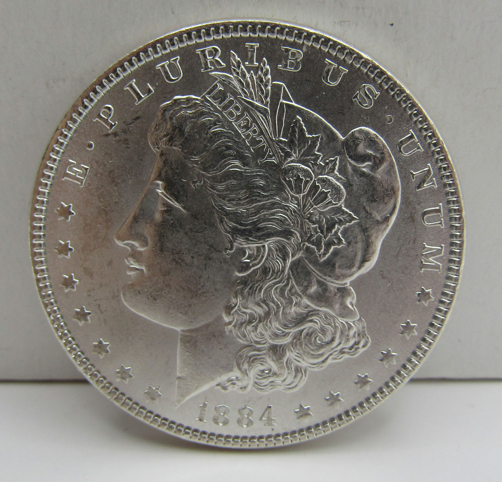 1884 UNC MORGAN US SILVER DOLLAR COIN (1 of 2)