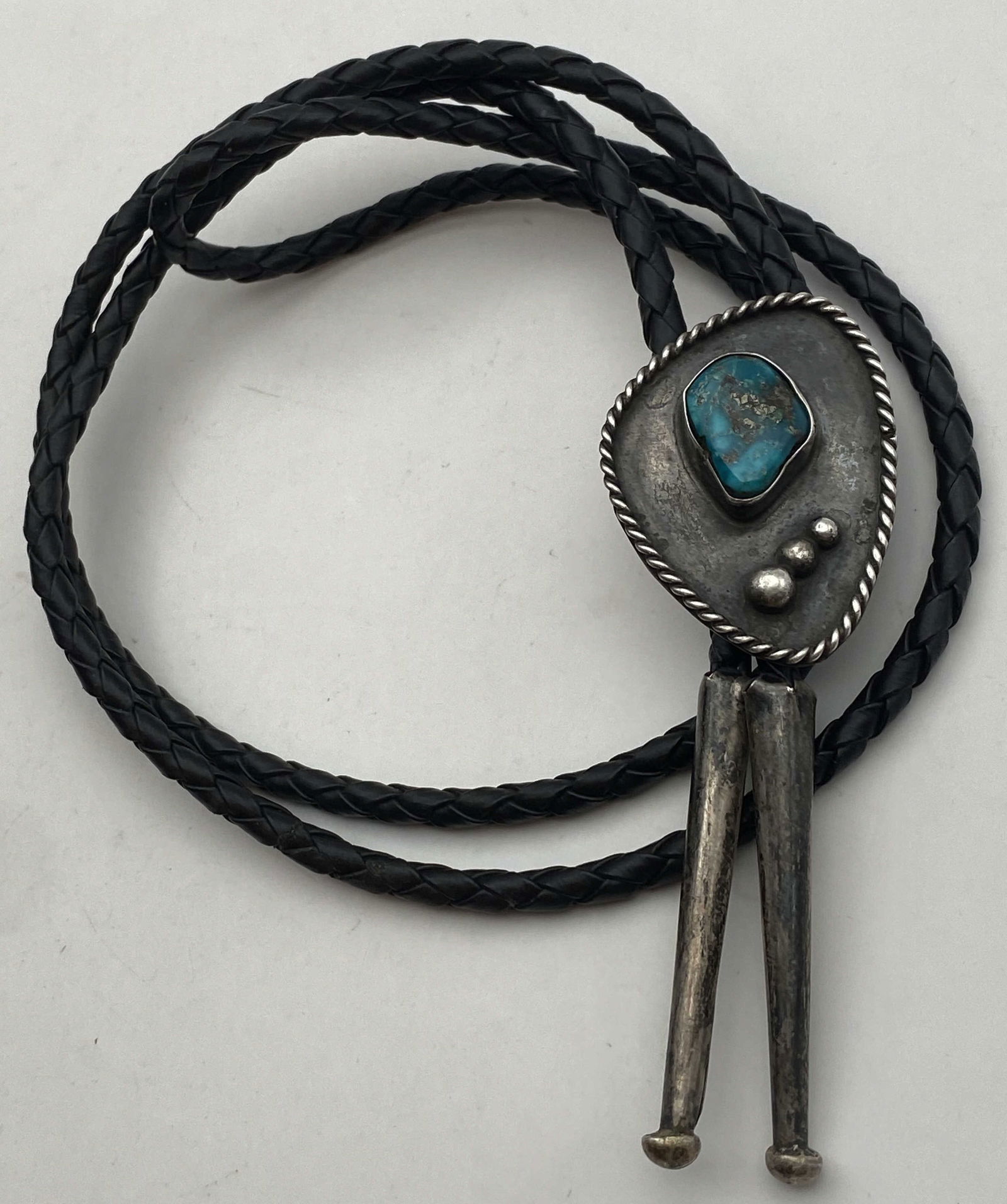 1970 OLD PAWN STERLING TURQUOISE BOLO TIE NECKLACE: VINTAGE 1970S NATIVE AMERICAN HANDMADE NAVAJO BOLO TIE NECKLACE. UNSIGNED UNMARKED TESTED STERLING SILVER. PENDANT IS 1.5" X 1". WEIGHS 21.3 GRAMS TOTAL WITH 34" LEATHER. USA SHIPPING $5.
