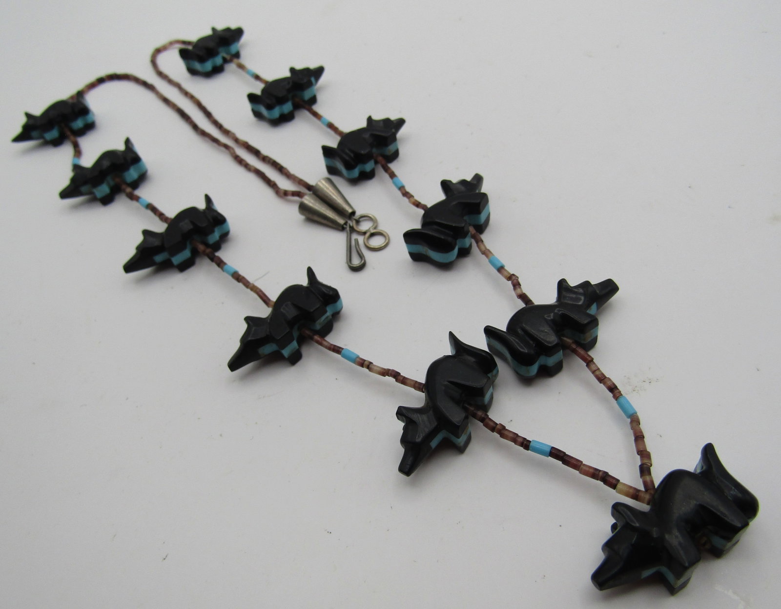 28" 11 SKUNK FETISH NECKLACE TURQUOISE HEISHI BEAD: SKUNKS ARE HIGHLY REGARDED IN THE NATIVE CULTURE; SYMBOLS OF PACIFISM, FERTILITY, FRESH STARTS, NEW BEGINNINGS & REGENERATION. MEASURES 28 INCHES LONG OVERALL; WITH 11 SKUNKS; UP TO 27MM BY 14MM. WEIG