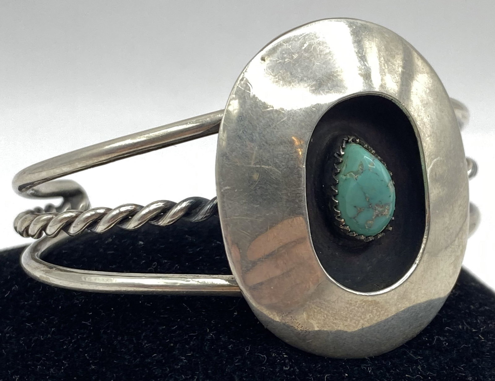 STERLING NAVAJO SHADOWBOX TURQUOISE BRACELET: NATIVE AMERICAN HANDMADE CUFF BRACELET. UNMARKED UNSIGNED. TESTED STERLING SILVER. HEIGHT IS 1-5/8". GAP IS 1-1/4" AND FITS 6-3/8" WRIST TOTAL. WEIGHS 34.5 GRAMS. USA SHIPPING $5.