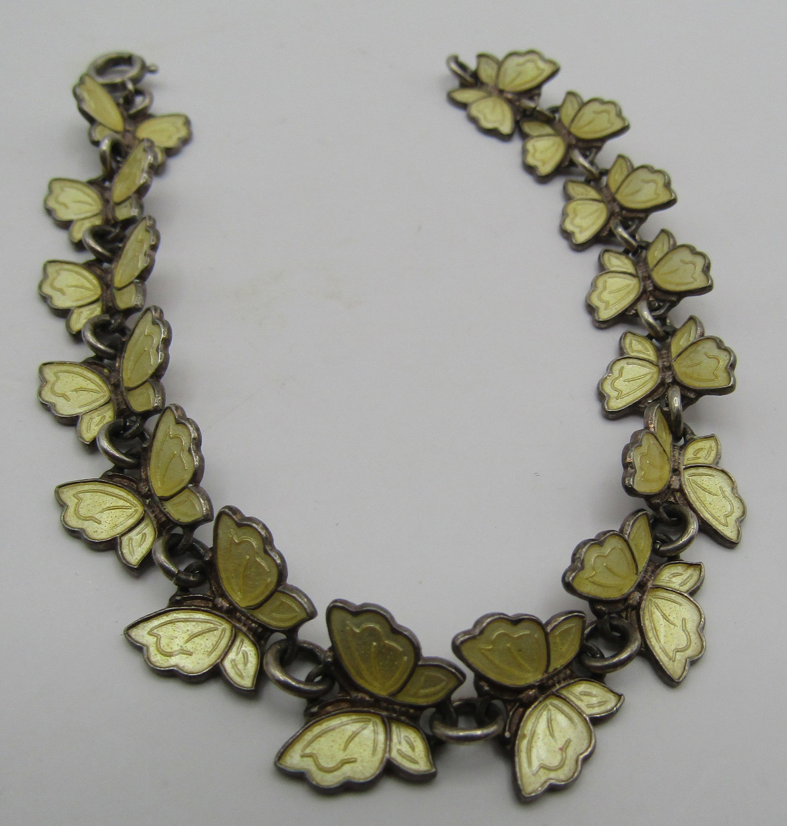 MEKA ENAMEL BUTTERFLY BRACELET STERLING SILVER: VINTAGE ESTATE MARKED 'MEKA STERLING DENMARK" YELLOW ENAMEL 15 BUTTERFLY BRACELET. MEASURES 6.5 INCHES LONG. WEIGHS 10 GRAMS. EXCELLENT USED CONDITION. USA SHIPPING $5.
