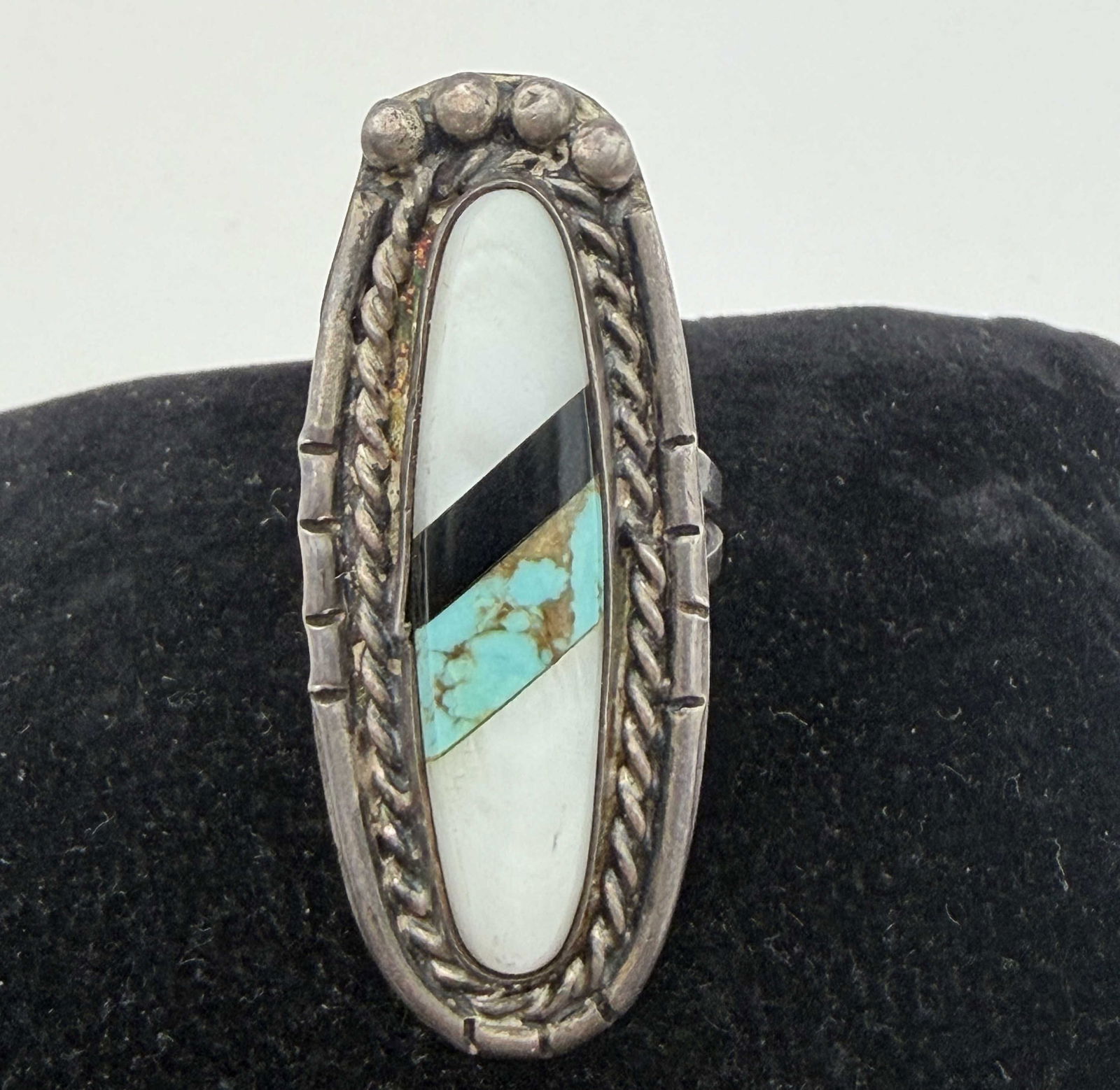 STERLING NATIVE AMERICAN ELONGATED TURQUOISE RING: NATIVE AMERICAN HANDMADE TURQUOISE ONYX AND MOTHER OF PEARL SHELL RING. UNMARKED UNSIGNED TESTED STERLING SILVER. WEIGHS 8 GRAMS. FACE OF RING IS 1-5/8" TALL. RING SIZE 6. USA SHIPPING $5.