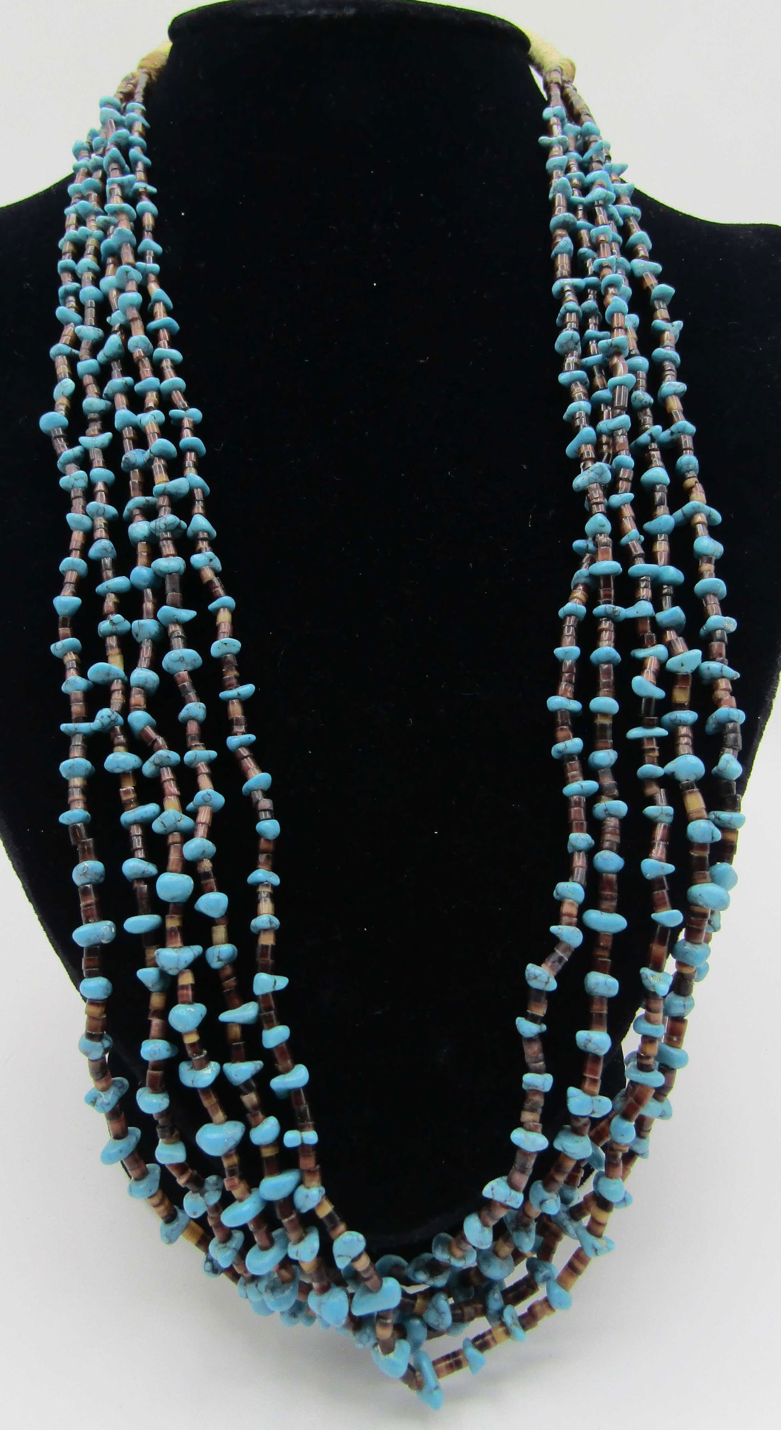 28" 5 STRAND TURQUOISE NUGGET HEISHI BEAD NECKLACE: 28 INCH LONG NECKLACE WITH 5 STRANDS OF HEISHI BEADS AND TURQUOISE NUGGETS. WEIGHS 57.1 GRAMS. EXCELLENT USED CONDITION. USA SHIPPING $5.