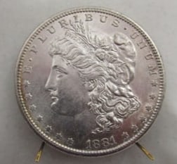 1881s UNCIRCULATED MORGAN SILVER DOLLAR.
