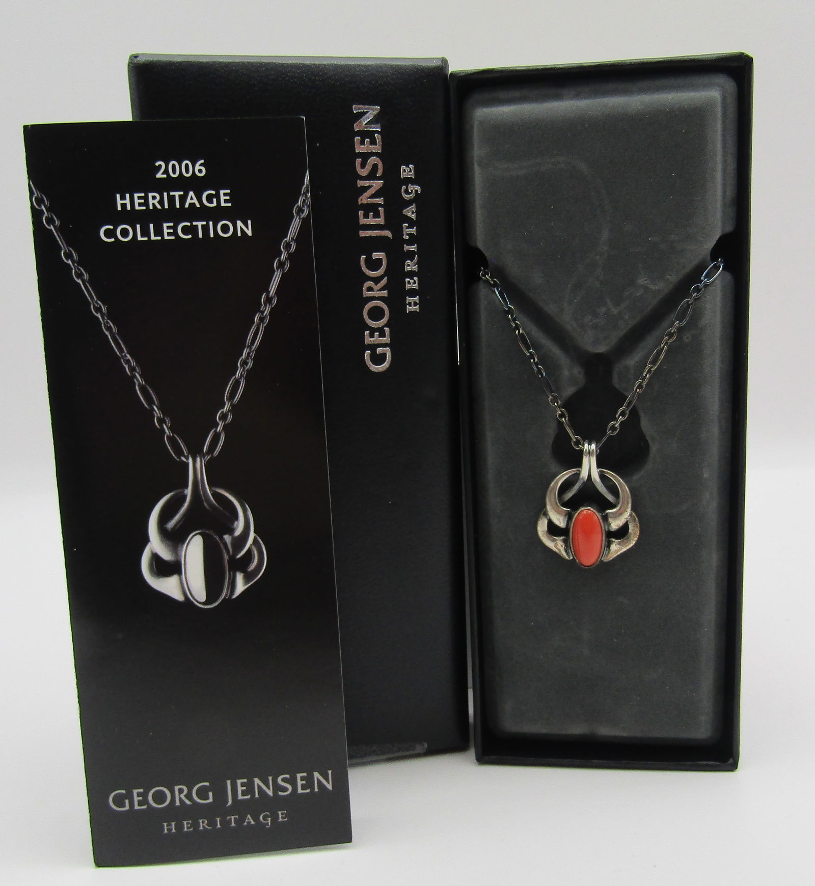 GEORG JENSEN 2006 MOONSTONE NECKLACE STERLING SILV: AUTHENTIC SIGNED " GEORG JENSEN 2006 925S DENMARK" IN THE ORIGINAL JENSEN BOX WITH PAPERWORK. NEVER USED CONDITION. LINK CHAIN MEASURES 18 INCHES PLUS ORANGE MOONSTONE PENDANT. WEIGHS 10.0 GRAMS. USA