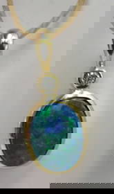 14K GOLD DIAMOND & BLACK OPAL NECKLACE PENDANT: GENUINE VINTAGE ESTATE NATURAL DIAMOND & OPAL CHARM. MEASURES 3/4 INCH BY 3/8" WIDE. WEIGHS 1.1 GRAMS; TESTED 14K YELLOW GOLD. EXCELLENT USED CONDITION. USA SHIPPING $5