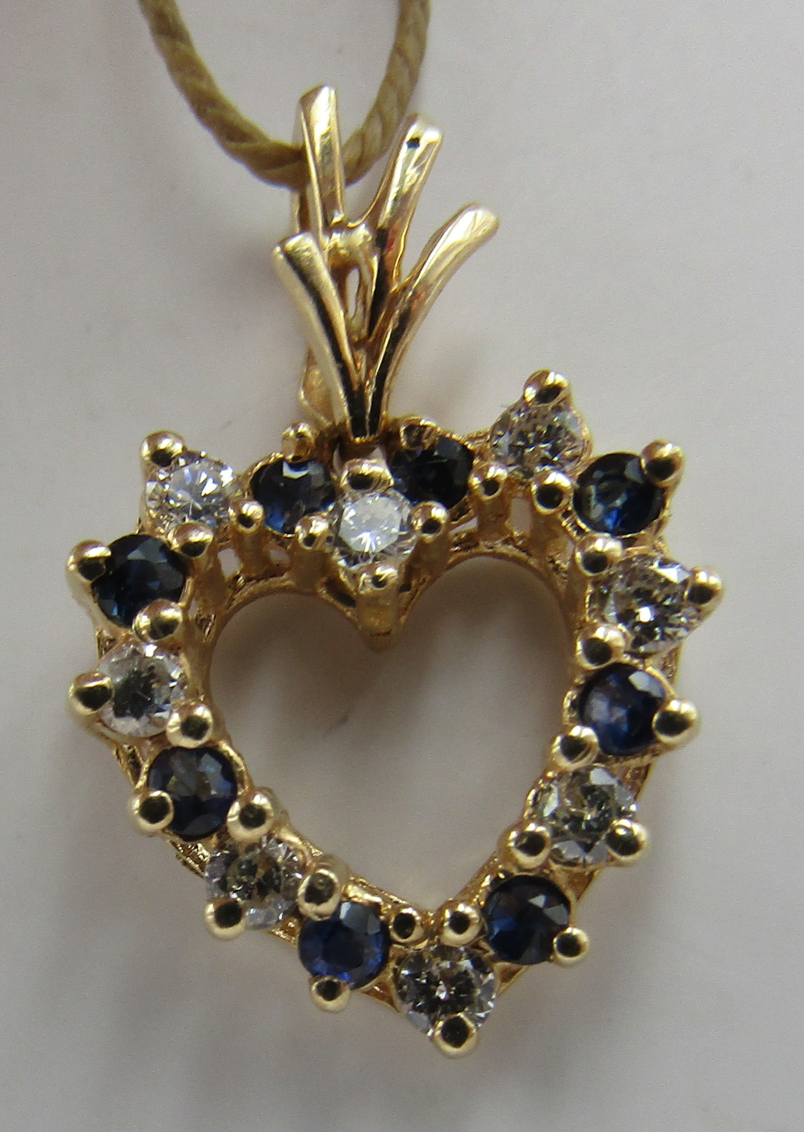 .25CT SAPPHIRE &.25CT DIAMOND HEART 14K GOLD: GENUINE VINTAGE ESTATE .25CT NATURAL 8 DIAMONDS & .25CT 8 BLUE SAPPHIRES NECKLACE PENDANT HEART. WEIGH 1.6 GRAMS TESTED 14K YELLOW GOLD. MEASURES 1 INCH. EXCELLENT CONDITION. USA SHIPPING $5