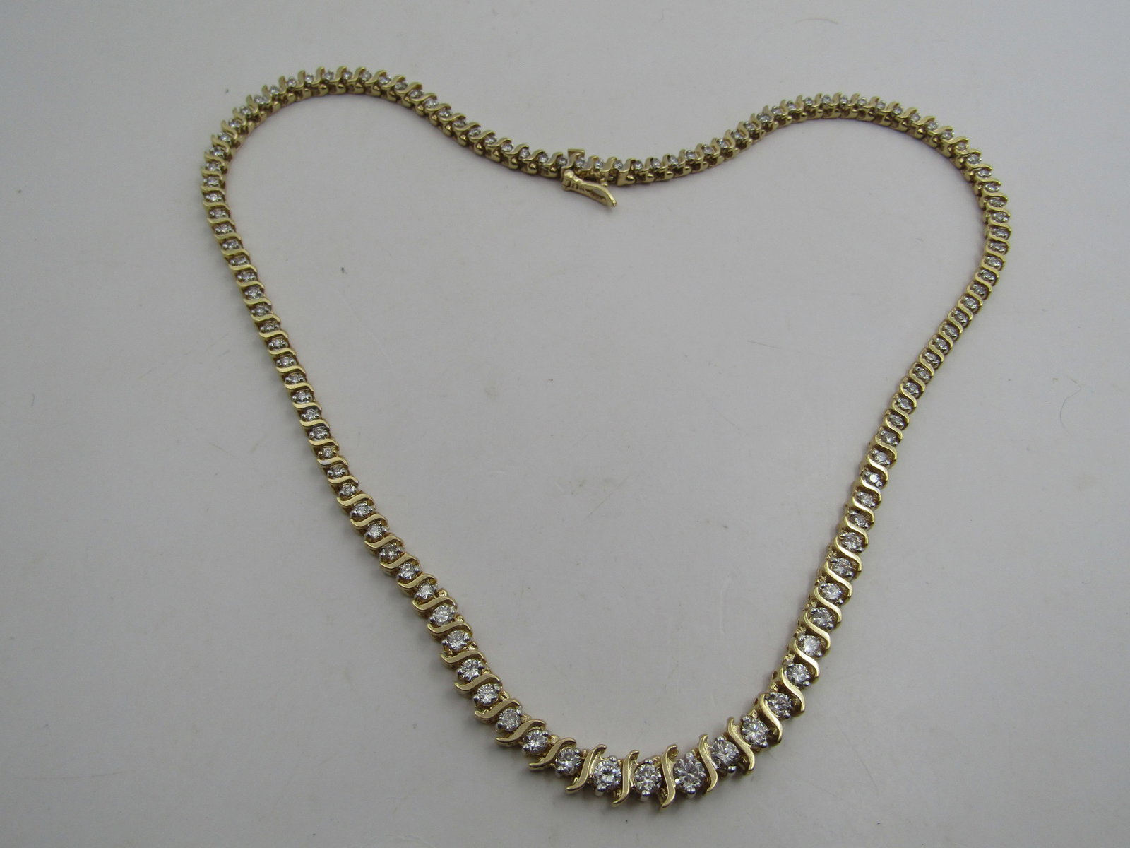 8.50 CARAT DIAMOND TENNIS NECKLACE 14K: 14K YELLOW GOLD NATURAL DIAMOND NECKLACE WITH 114 ROUND WHITE SI, H-I COLOR ROUND DIAMONDS. 8.5 CARATS NATURAL DIAMONDS. 14K YELLOW GOLD 29.2 GRAMS. 16INCH LONG. HALLMARKED WITH "M" USA SHIPPING ONLY 