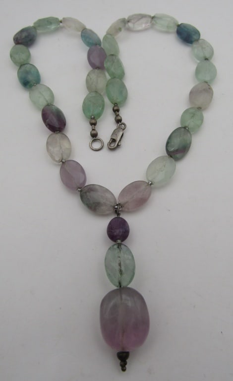 200CT FACETED TOURMALINE NECKLACE STERLING SILVER: VINTAGE ESTATE 17 INCH LONG PLUS A 2 INCH DROP OF 3 STONES. 31 FACETED TOURMALINE STONES; NECKLACE WEIGHS 48.8GRAMS. EXCELLENT USED CONDITION. USA SHIPPING $5.