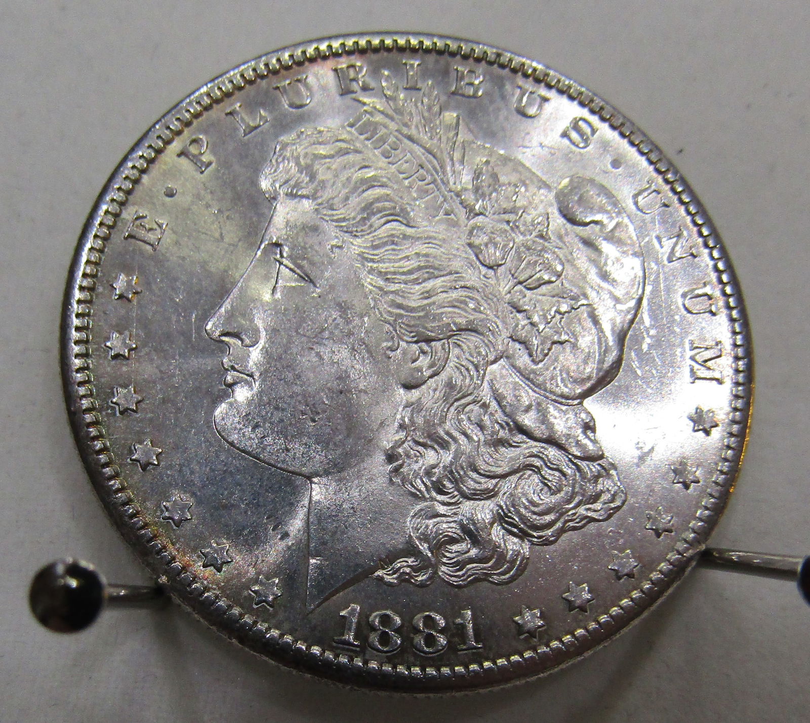 UNCIRCULATED 1881 S MINT MORGAN SILVER DOLLAR: 1881 S UNCIRCULATED SILVER DOLLAR. WITH IMPERIAL AUCTION THE COST FOR PACKING AND SHIPPING VIA USPS IN THE USA IS $5.