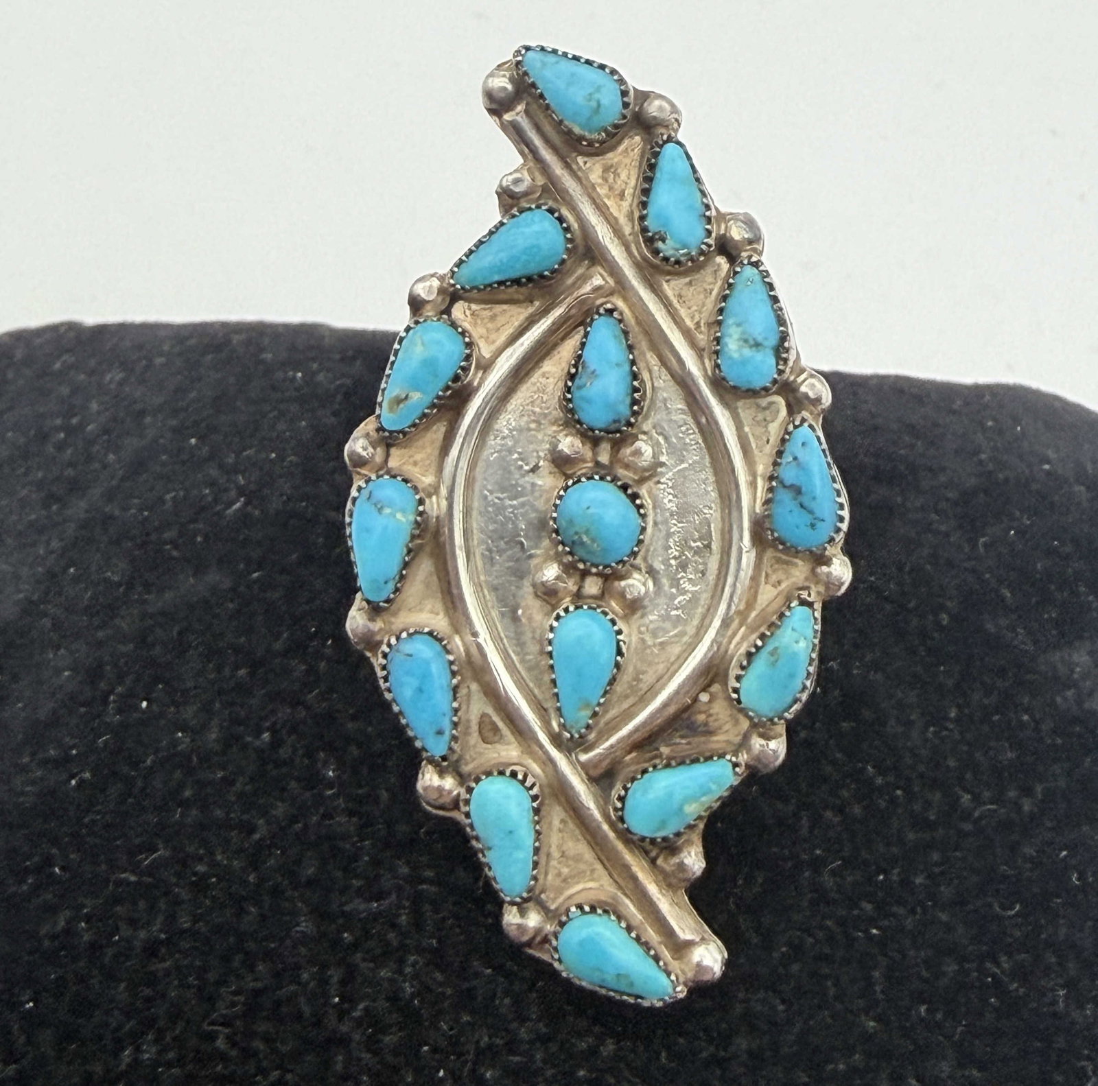 1.75" ZUNI STERLING TURQUOISE HUMMINGBIRD RING: "NN" NATIVE AMERICAN HANDMADE SNAKE EYE RING. GEM QUALITY MINED TURQUOISE STONES. MARKED SIGNED "NN" TESTED STERLING SILVER. WEIGHS 6.8 GRAMS. FACE OF RING IS 1-3/4" TALL. RING SIZE 5. WITH IMPERIAL A