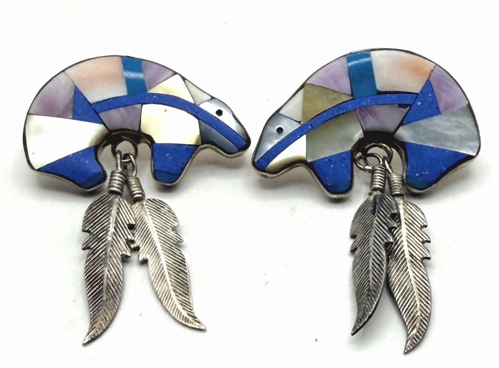 INLAID SHELL LAPIS STERLING BEAR FEATHER EARRINGS: WEIGHS 11.4 GRAMS. MEASURES 1.75" X 1.25". MARKED TESTED STERLING SILVER. WITH IMPERIAL AUCTION THE COST FOR PACKING AND SHIPPING VIA USPS IN THE USA IS $5.