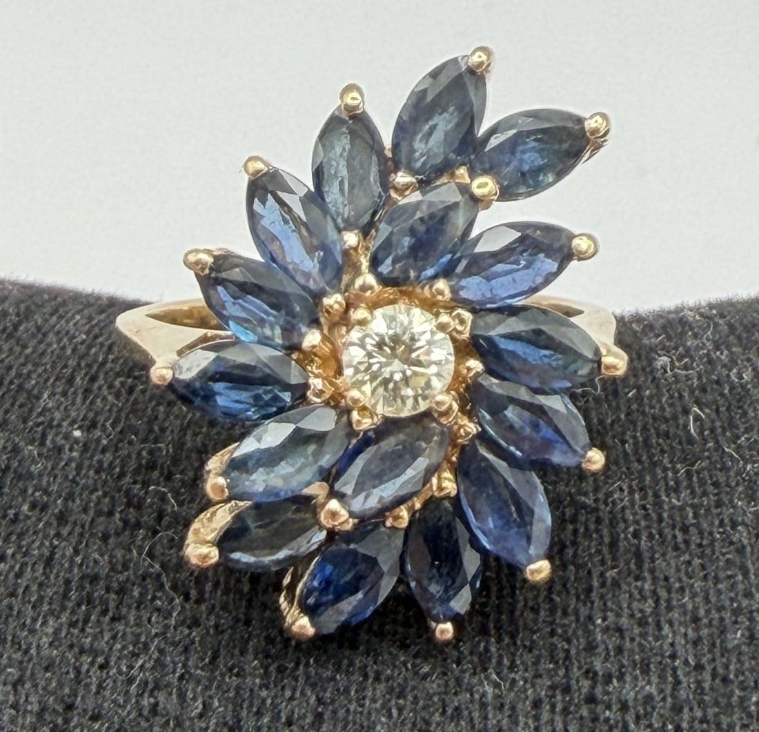 1.5CT SAPPHIRE DIAMOND RING 14K GOLD 4.8GRAMS: GENUINE VINTAGE ESTATE 15 BLUE SAPPHIRES WITH 1 DIAMOND.15CT. MOUNTED IN MARKED 14K YELLOW GOLD. SIZE 6. WEIGHS 4.8 GRAMS. EXCELLENT USED CONDITION. WITH IMPERIAL AUCTION THE COST FOR