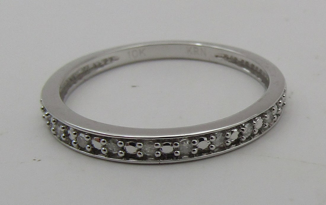 10 NATURAL DIAMOND BAND RING WHITE GOLD 10K: 10 GENUINE NATURAL DIAMONDS. MOUNTED IN 10K WHITE GOLD MOUNTING. SIZE 7. WEIGHS 1.4 GRAMS, EXCELLENT, NEW CONDITION. WITH IMPERIAL AUCTION THE COST FOR PACKING AND SHIPPING VIA USPS IN THE USA IS $5.