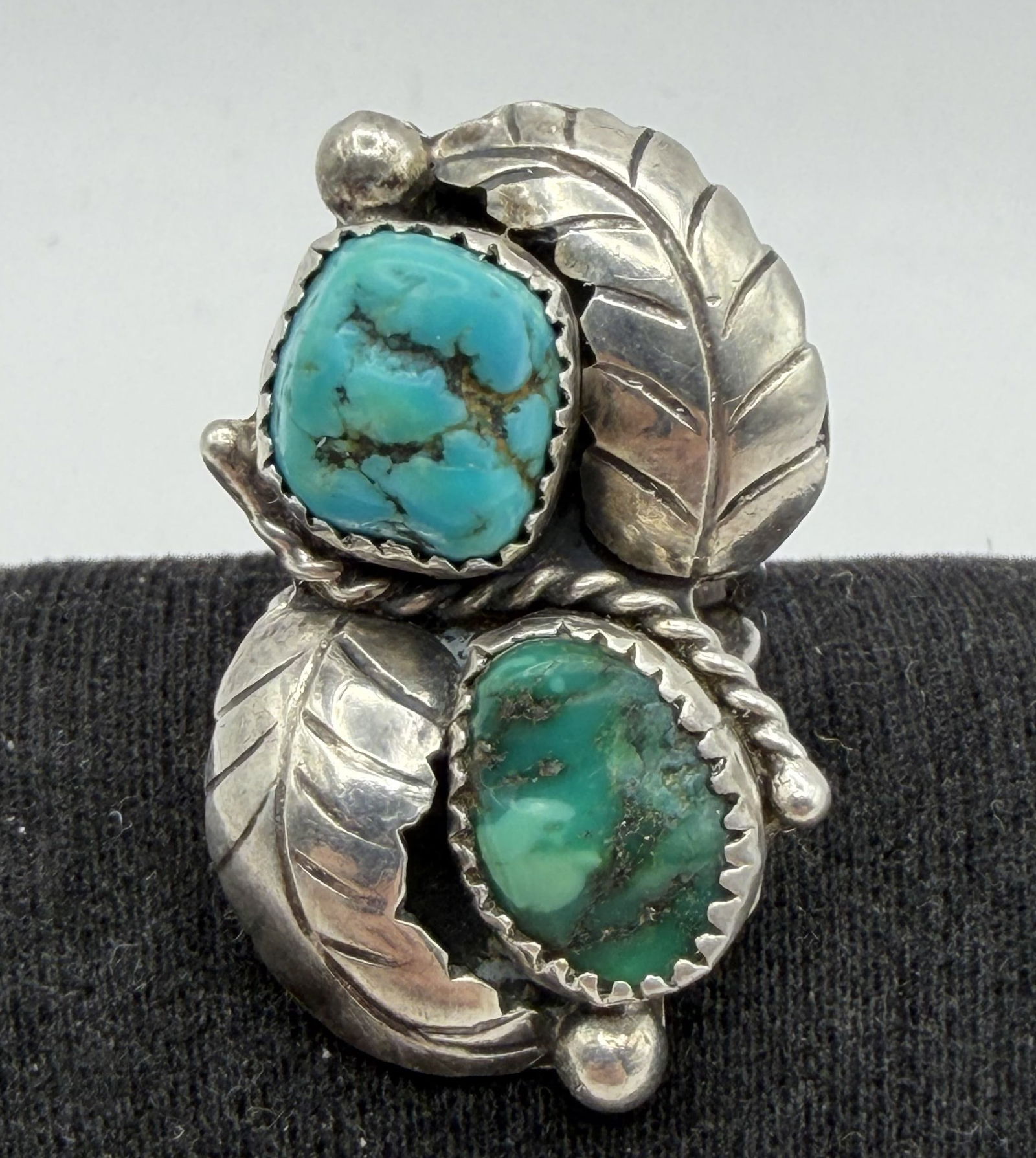 OLD PAWN STERLING NATIVE AMERICAN RING: VINTAGE HANDMADE NATIVE AMERICAN RING. UNSIGNED WITH PAWN MARKINGS TESTED STERLING SILVER. WEIGHS 9.1 GRAMS. FACE IS 1-3/8" TALL. RING SIZE 3.5. WITH IMPERIAL AUCTION THE COST FOR PACKING AND SHIPPING