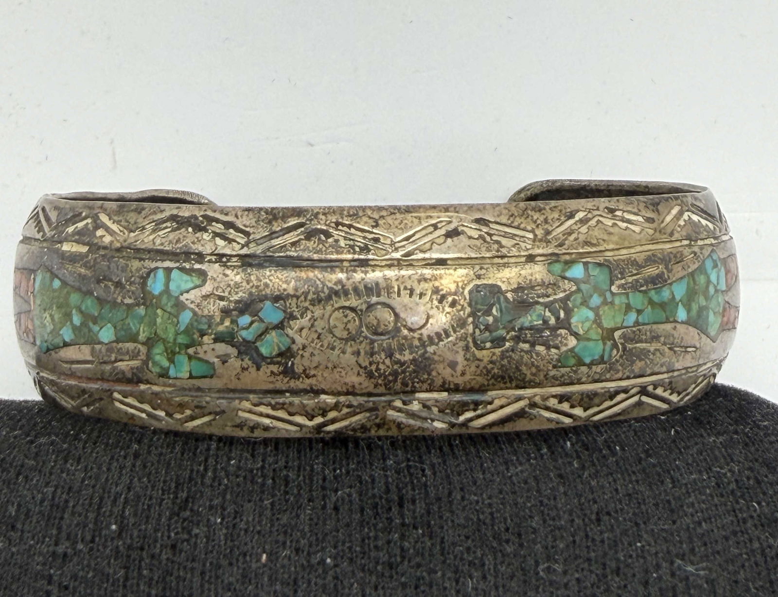 J NEZZIE 1960S TURQUOISE STERLING BRACELET: VINTAGE OLD PAWN NATIVE AMERICAN HANDMADE CUFF BRACELET. SIGNED "J NEZZIE" TESTED STERLING SILVER. WEIGHS 24.5 GRAMS. FACE IS 5/8" TALL. GAP IS 1-1/8" AND FITS 6-3/4" WRIST. WITH IMPERIAL AUCTION THE