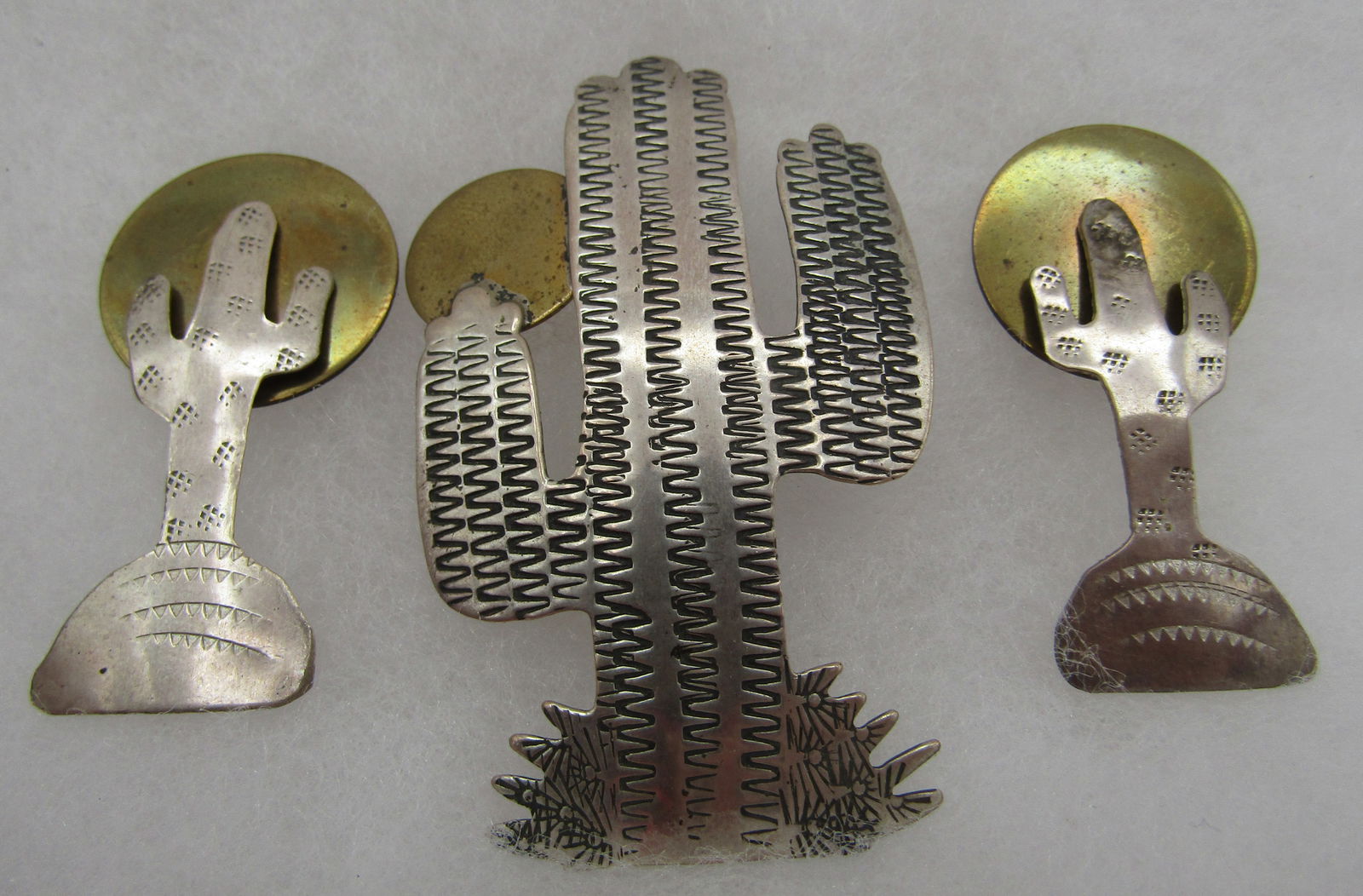 BEN CHAVEZ CACTUS PIN & EARRINGS STERLING SILVER: CATUS EARRINGS UNSIGNED; BUT THE BROOCH IS ARTIST SIGNED "BEN J CHAVEZ & STERLING". NATIVE AMERICAN SOUTHWEST INDIAN NAVAJO JEWELRY. PIN MEASURES 2 1/2 INCHES. EARRINGS MEASURE 1 3/4". TOTAL WEIGHT 17
