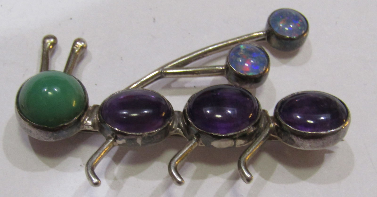 ALICE PLATERO OPAL JADE AMETHYST BUG PIN STERLING: ARTIST SIGNED "ALICE PLATERO STERLING" MEASURE 2 INCHES LONG WITH JADE, AMETHYST & OPAL. NATIVE AMERICAN SOUTHWEST NAVAJO INDIAN JEWELRY. WEIGHS 8.0 GRAMS. EXCELLENT CONDITION. WITH IMPERIAL AUCTION T
