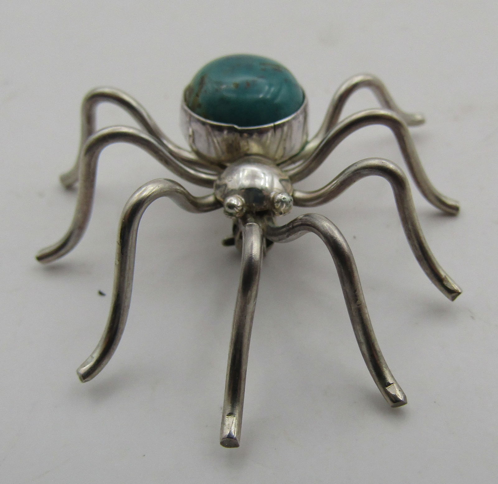 1.5" TURQUOISE SPIDER PIN STERLING SILVER BUG: VINTAGE ESTATE GEM TURQUOISE PIN MARKED "STERLING" SILVER NATIVE AMERICAN SOUTHWEST INDIAN NAVAJO JEWELRY. MEASURES 1 1/2 INCHES BY 1 3/8 INCHES. WEIGHS 4.5 GRAMS. EXCELLENT CONDITION. WITH IMPERIAL A