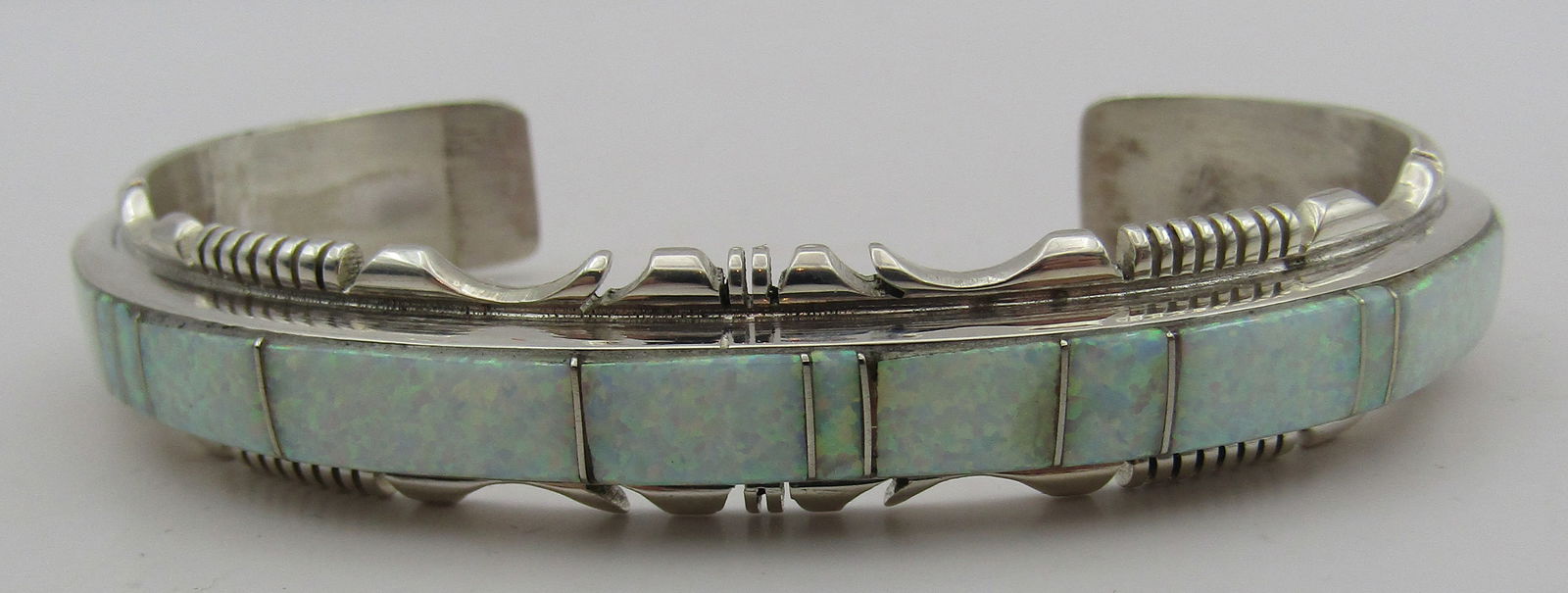 "FRANCISCO" OPAL CUFF BRACELET STERLING SILVER: ARTIST HALLMARKED "SF STERLING". NATIVE AMERICAN SOUTHWEST NAVAJO INDIAN JEWELRY. FITS A 7.5 INCH WITH A 35MM GAP. MEASURES 1/2 INCH WIDE. WEIGHS 22.4 GRAMS. EXCELLENT CONDITION. WITH